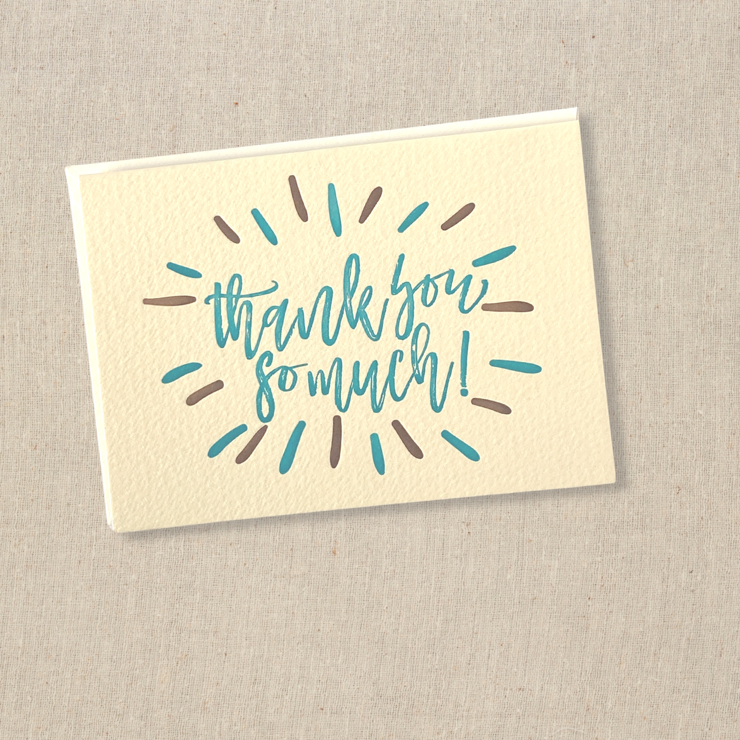 greeting card in turquoise and brown ink on cream colored paper.